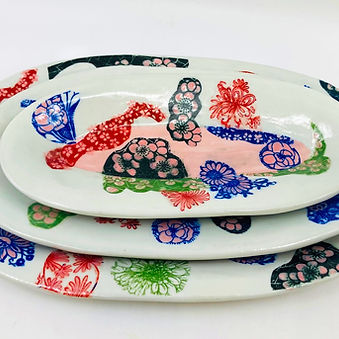 A Set of Three Porcelain Trays with Multi Color Collage Patterns